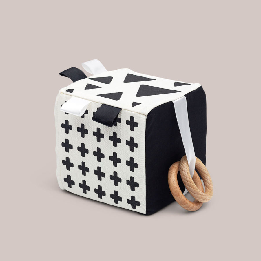 Sensory Cube toy for babies with black and white features.