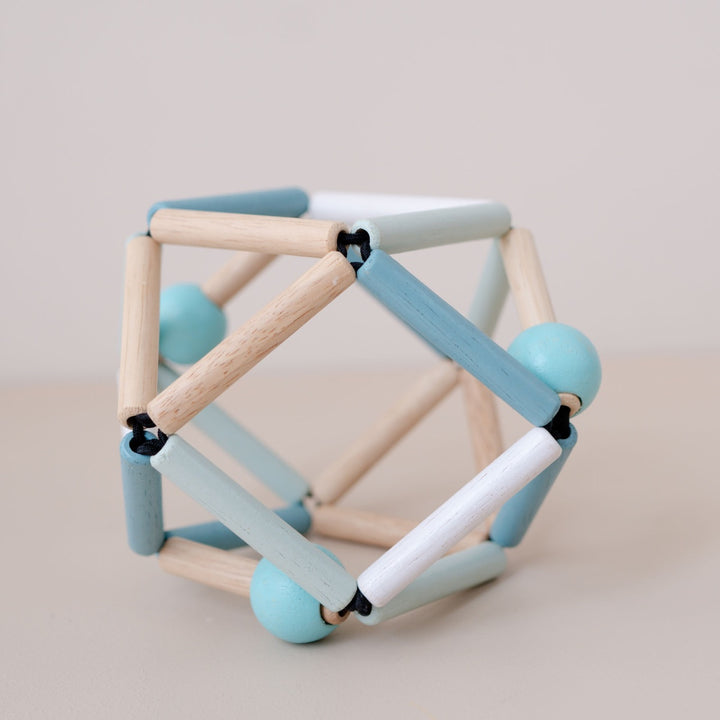 Wooden grabbing toy for babies brain development.